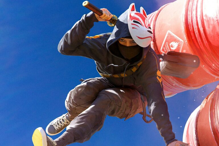Player jumping over explosive barrels in The Finals