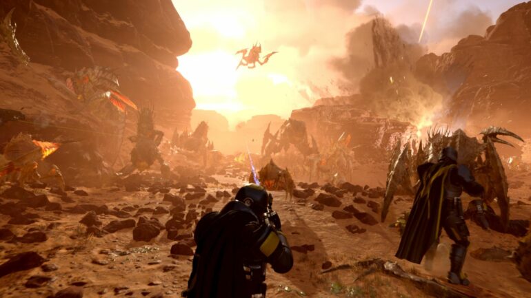 Players shooting Terminids in Helldivers 2
